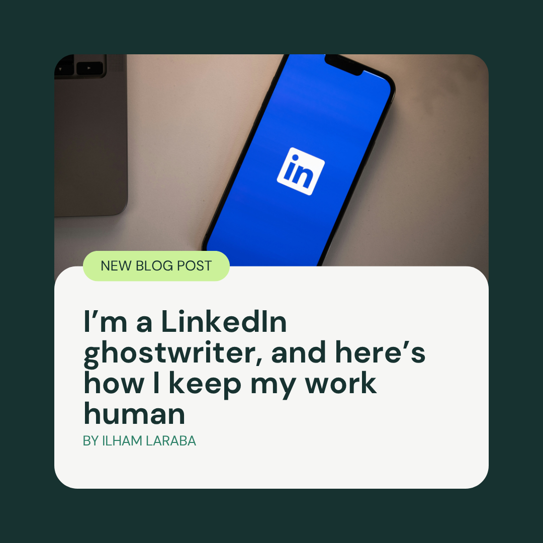 A smartphone displaying the LinkedIn logo lies on a desk next to a laptop, overlaid with a blog post title: I’m a LinkedIn ghostwriter, and here’s how I keep my work human